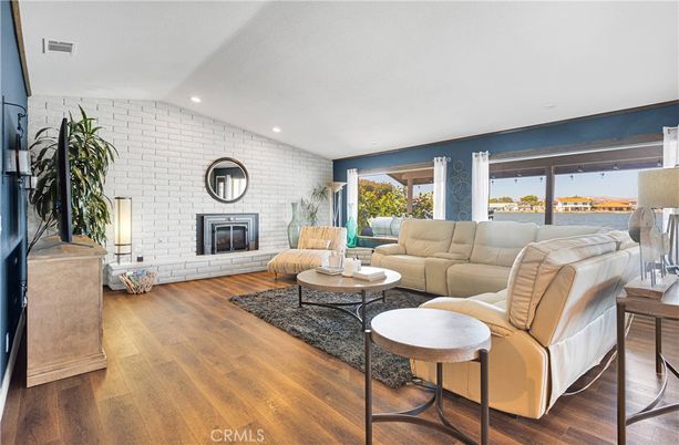 Fireplace, Interior, Living room, Recessed Lighting, Stone Walls, Water, Wood Texture Flooring