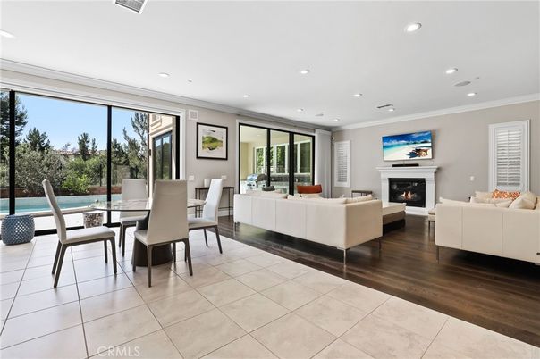 Dining room, Fireplace, Interior, Living room, Recessed Lighting, Wood Texture Flooring