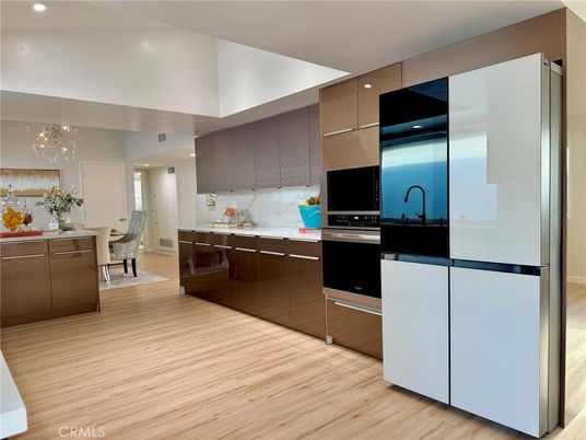 Chandelier, Dining room, Interior, Kitchen, Recessed Lighting, Stainless Steel Appliances, Wood Texture Flooring