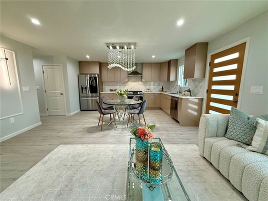 Chandelier, Dining room, Interior, Kitchen, Recessed Lighting, Stainless Steel Appliances, Wood Texture Flooring