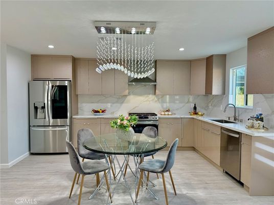 Dining room, Interior, Kitchen, Marble Walls, Pendant Lights, Recessed Lighting, Stainless Steel Appliances, Wood Texture Flooring