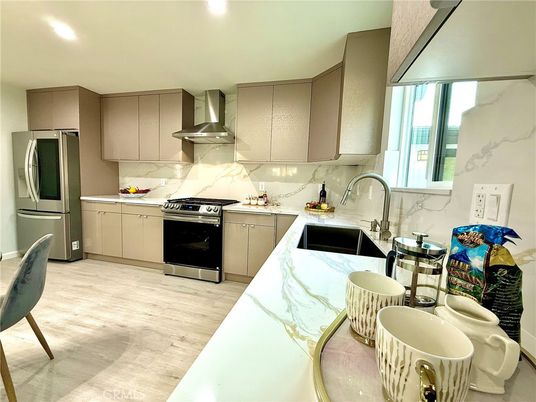 Interior, Kitchen, Marble Walls, Recessed Lighting, Stainless Steel Appliances, Wood Texture Flooring