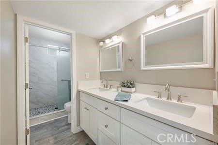 Bathroom, Dual Sink Vanities, Glass Shower, Interior, Marble Walls, Wood Texture Flooring