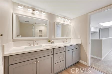 Bathroom, Dual Sink Vanities, Interior, Recessed Lighting, Wood Texture Flooring