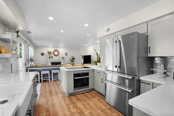 Fireplace, Interior, Kitchen, Recessed Lighting, Stainless Steel Appliances, Wood Texture Flooring