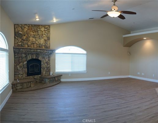 Empty room, Fireplace, Interior, Recessed Lighting, Stone Walls, Wood Texture Flooring