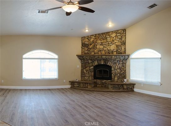 Empty room, Fireplace, Interior, Recessed Lighting, Stone Walls, Wood Texture Flooring