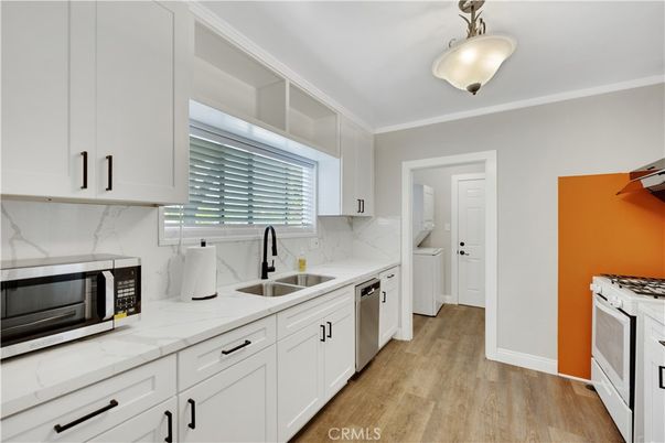Interior, Kitchen, Marble Walls, Stainless Steel Appliances, Wood Texture Flooring