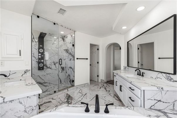 Bathroom, Dual Sink Vanities, Glass Shower, Interior, Marble, Marble Walls, Recessed Lighting