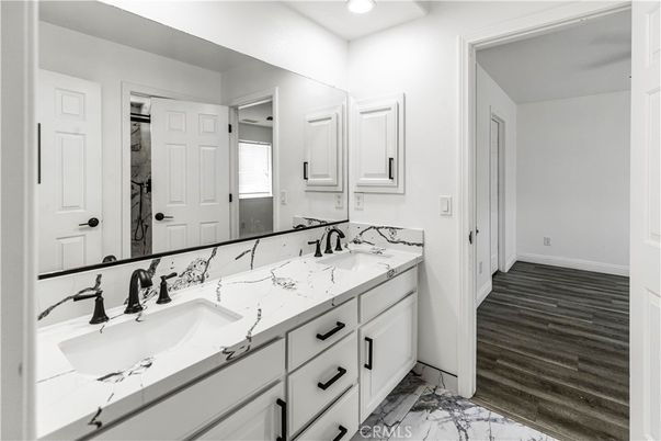 Bathroom, Dual Sink Vanities, Interior, Marble, Recessed Lighting, Wood Texture Flooring