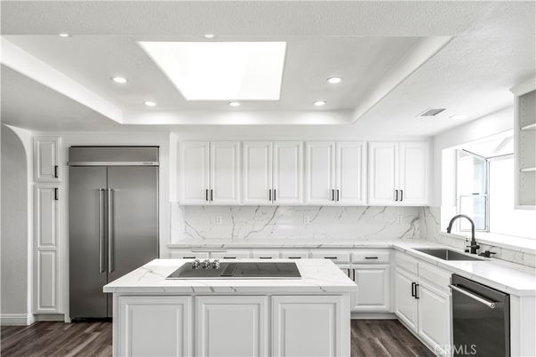 Interior, Kitchen, Marble Walls, Recessed Lighting, Stainless Steel Appliances, Wood Texture Flooring