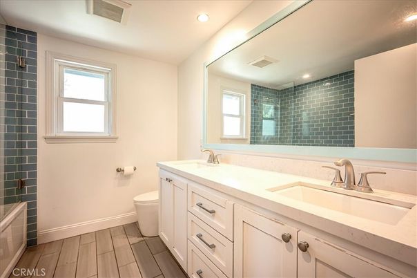 Bathroom, Dual Sink Vanities, Interior, Recessed Lighting, Wood Texture Flooring