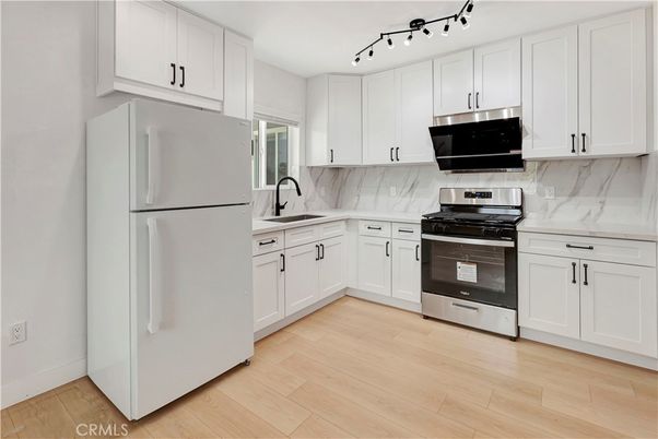 Interior, Kitchen, Marble Walls, Stainless Steel Appliances, Wood Texture Flooring