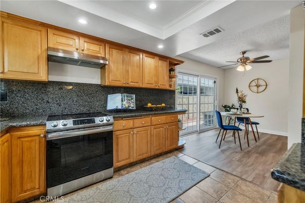 Dining room, Interior, Kitchen, Recessed Lighting, Stainless Steel Appliances, Wood Texture Flooring