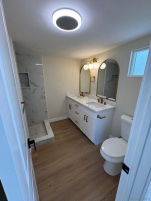 Bathroom, Dual Sink Vanities, Interior, Marble Walls, Wood Texture Flooring