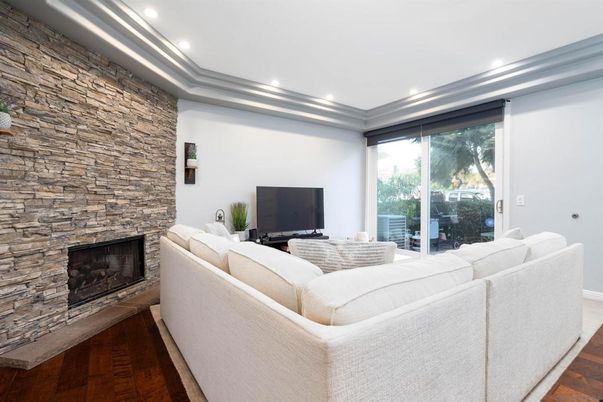 Fireplace, Interior, Living room, Recessed Lighting, Stone Walls, Wood Texture Flooring