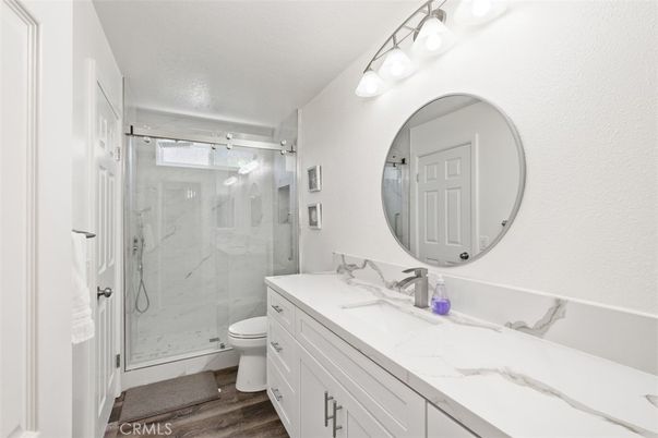 Bathroom, Glass Shower, Interior, Marble Walls, Wood Texture Flooring