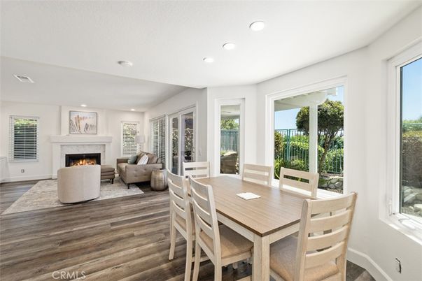 Dining room, Fireplace, Interior, Living room, Recessed Lighting, Wood Texture Flooring
