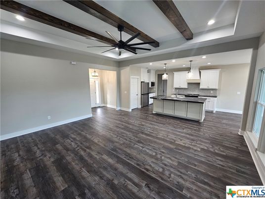 Empty room, Interior, Kitchen, Pendant Lights, Recessed Lighting, Stainless Steel Appliances, Wooden Beams, Wood Texture Flooring