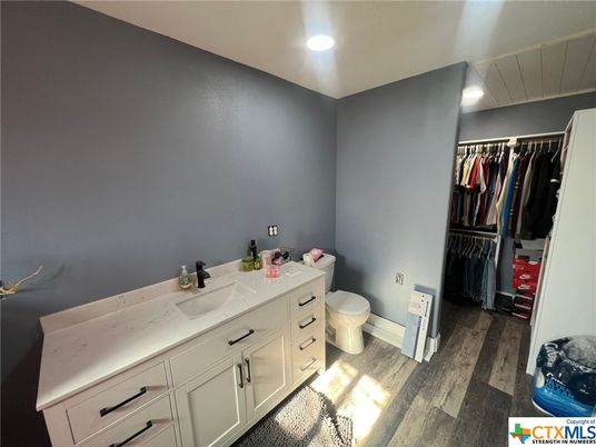 Bathroom, Dual Sink Vanities, Interior, Recessed Lighting, Walk-in Closets, Wood Texture Flooring