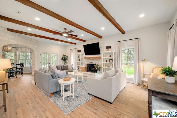 Dining room, Fireplace, Interior, Living room, Recessed Lighting, Wooden Beams, Wood Texture Flooring