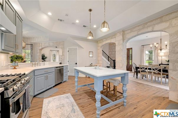 Dining room, Interior, Kitchen, Pendant Lights, Recessed Lighting, Stainless Steel Appliances, Wood Texture Flooring