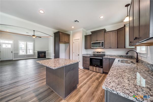 Fireplace, Interior, Kitchen, Pendant Lights, Recessed Lighting, Stainless Steel Appliances, Wood Texture Flooring