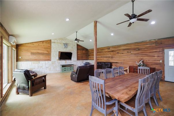 Dining room, Fireplace, Interior, Living room, Recessed Lighting, Stone Walls, Wooden Walls