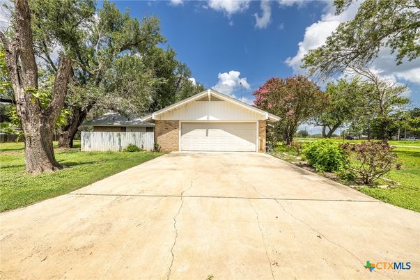 Attached, Backyard, Exterior, Facade, Brick Facade, None