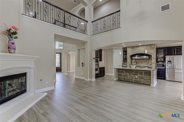 Fireplace, Interior, Kitchen, Recessed Lighting, Stone Walls, Wood Texture Flooring