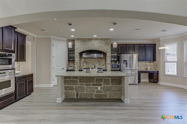 Interior, Kitchen, Pendant Lights, Recessed Lighting, Stainless Steel Appliances, Stone Walls, Wood Texture Flooring