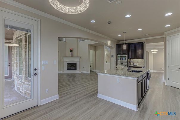 Fireplace, Interior, Kitchen, Pendant Lights, Recessed Lighting, Stainless Steel Appliances, Wood Texture Flooring