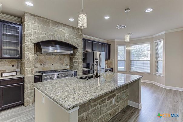 Interior, Kitchen, Pendant Lights, Recessed Lighting, Stainless Steel Appliances, Stone Walls, Wood Texture Flooring