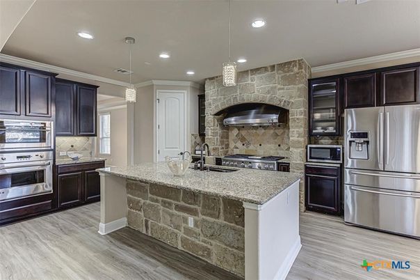 Interior, Kitchen, Pendant Lights, Recessed Lighting, Stainless Steel Appliances, Stone Walls, Wood Texture Flooring