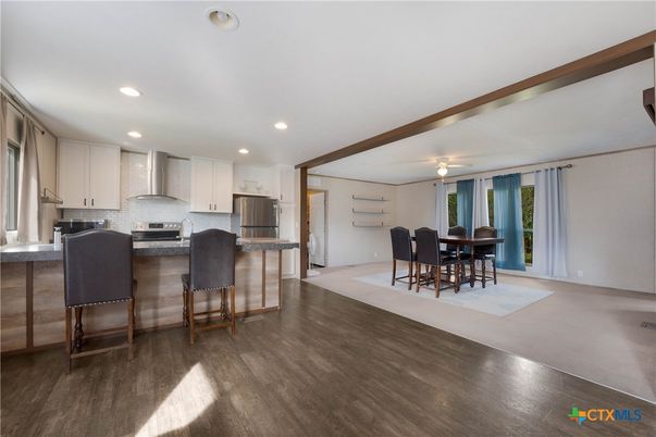 Dining room, Interior, Kitchen, Recessed Lighting, Stainless Steel Appliances, Wood Texture Flooring