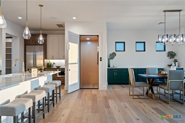 Dining room, Interior, Kitchen, Pendant Lights, Recessed Lighting, Stainless Steel Appliances, Wood Texture Flooring