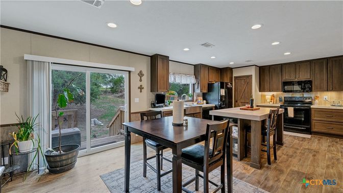Dining room, Interior, Kitchen, Recessed Lighting, Stainless Steel Appliances, Wood Texture Flooring