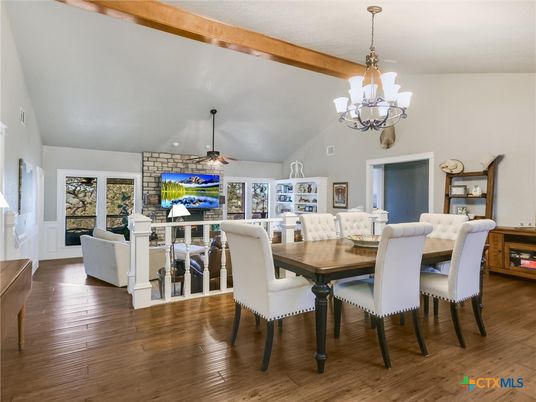 Chandelier, Dining room, Fireplace, Interior, Living room, Stone Walls, Wooden Beams, Wood Texture Flooring