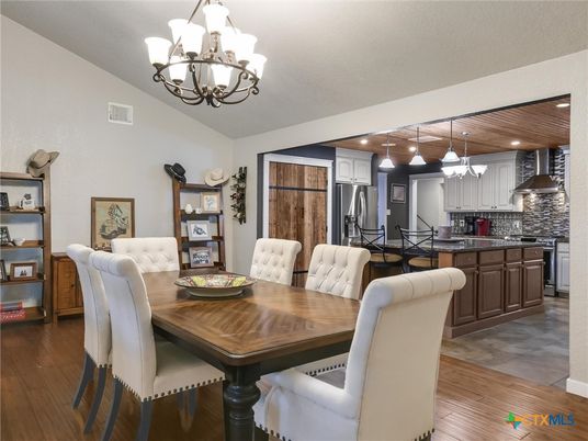 Chandelier, Dining room, Interior, Kitchen, Pendant Lights, Recessed Lighting, Stainless Steel Appliances, Wood Texture Flooring