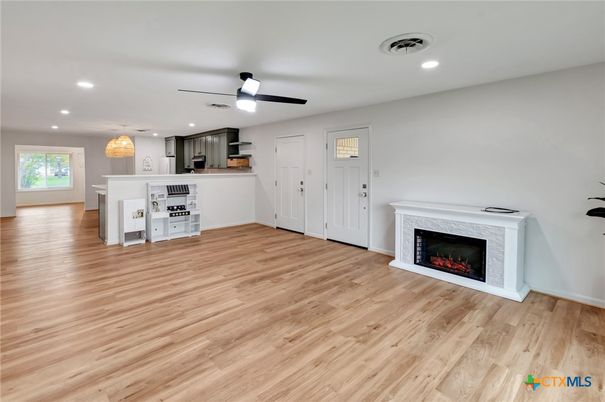 Empty room, Fireplace, Interior, Kitchen, Pendant Lights, Recessed Lighting, Wood Texture Flooring