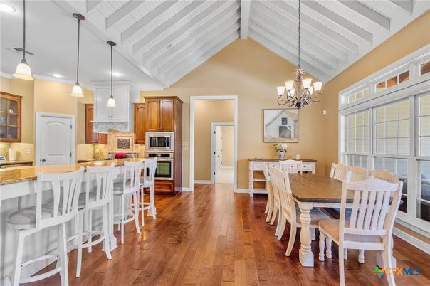 Chandelier, Dining room, Interior, Kitchen, Pendant Lights, Recessed Lighting, Stainless Steel Appliances, Wood Texture Flooring