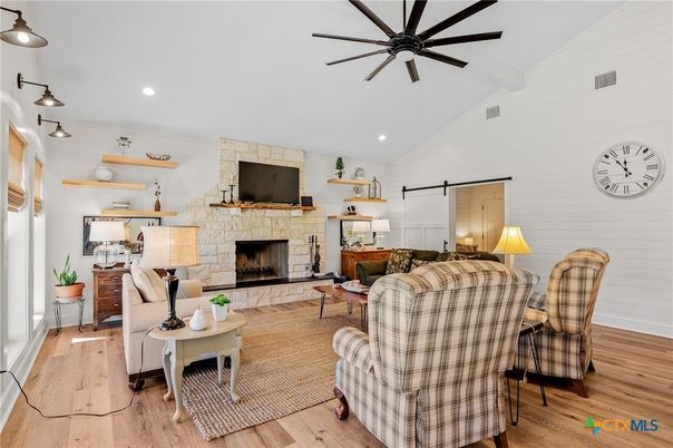 Fireplace, Interior, Living room, Recessed Lighting, Stone Walls, Wood Texture Flooring