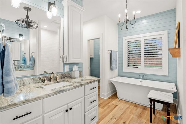 Bathroom, Chandelier, Dual Sink Vanities, Free Standing Baths, Interior, Pendant Lights, Recessed Lighting, Wood Texture Flooring