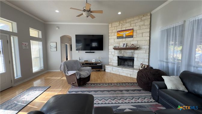 Fireplace, Interior, Living room, Recessed Lighting, Stone Walls, Wood Texture Flooring
