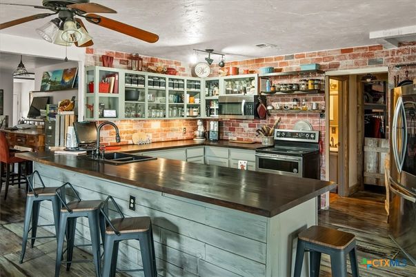 Interior, Kitchen, Stainless Steel Appliances, Stone Walls, Wood Texture Flooring