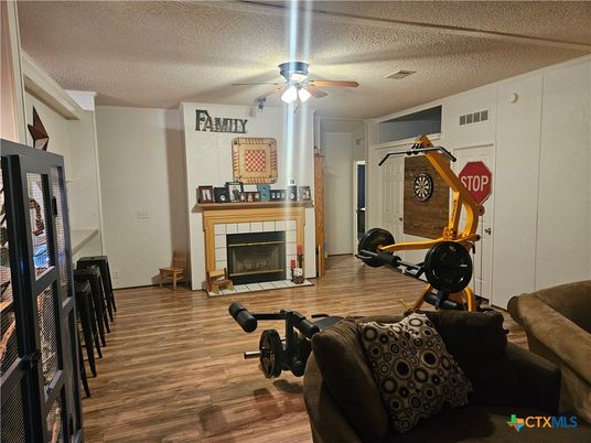 Fireplace, Fitness Equipment, Interior, Wood Texture Flooring