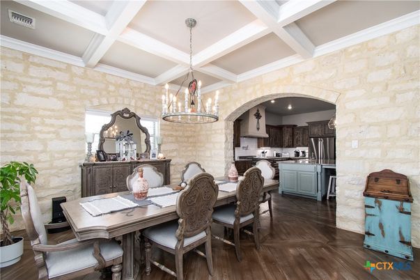 Chandelier, Dining room, Interior, Kitchen, Pendant Lights, Stainless Steel Appliances, Stone Walls, Wood Texture Flooring