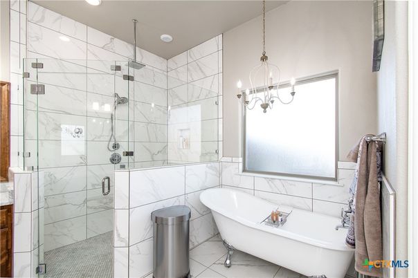 Bathroom, Free Standing Baths, Glass Shower, Interior, Marble, Marble Walls, Pendant Lights, Recessed Lighting