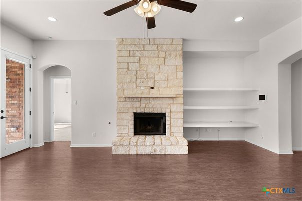 Empty room, Fireplace, Interior, Recessed Lighting, Stone Walls, Wood Texture Flooring