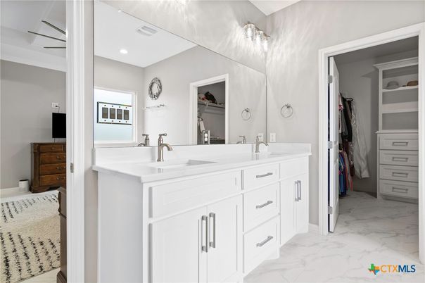 Bathroom, Dual Sink Vanities, Interior, Marble, Recessed Lighting, Walk-in Closets